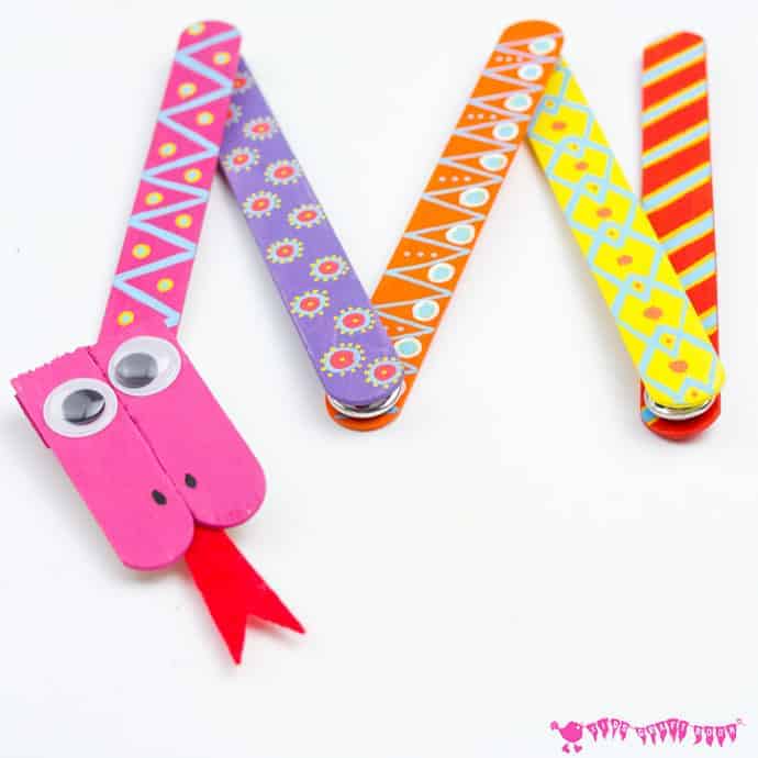 SNAKE CRAFT: This Mix 'N Match Articulated Snake Craft is such fun and twists, turns and slithers like a real one! With bright and colourful interchangeable body parts kids can make a unique snake toy every time they play! #snakecrafts #snakes #popsiclesticks #kidscrafts #kidscraft #kidcrafts #ECE #kidcraft #kidscrafts101 #craftideas #craftsforkids #funforkids #preschool #preK #earlyyears #letsgetcrafty #kidscreate #creativekids #craftykids #kidsactivities #activitiesforkids