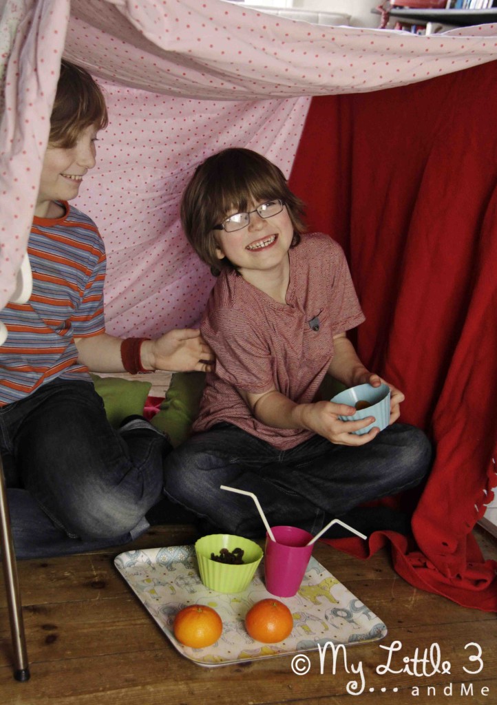 Here's another really simple DEN made by hanging sheets and blankets over 4 chairs.A great place for a tickle and a picnic!