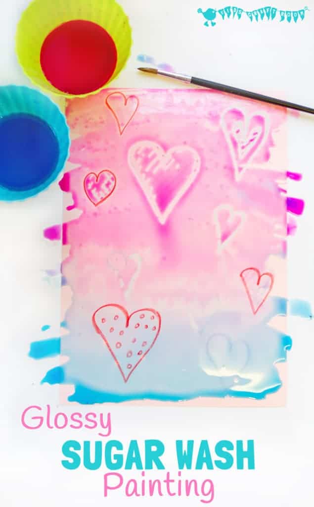 WAX RESIST SUGAR WASH PAINTING is a special and unusual painting activity for kids. It's colourful, glossy and finger licking good fun! Kids will love it! #valentine #valentinesday #valentinescraft #valentinecraft #valentinescrafts #valentinecrafts #valentinesdayforkids #heart #love #kidsart #processart #painting #paintingideas #kidspainting #paintingforkids #heartcrafts #kidscrafts #craftsforkids #kidsactivities #activitiesforkids #preschool #ECE