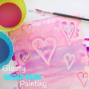 WAX RESIST SUGAR WASH PAINTING is a special and unusual painting activity for kids. It's colourful, glossy and finger licking good fun! Kids will love it! #valentine #valentinesday #valentinescraft #valentinecraft #valentinescrafts #valentinecrafts #valentinesdayforkids #heart #love #kidsart #processart #painting #paintingideas #kidspainting #paintingforkids #heartcrafts #kidscrafts #craftsforkids #kidsactivities #activitiesforkids #preschool #ECE