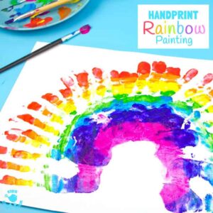 HANDPRINT RAINBOW PAINTING is a fun sensory art experience for kids. Get "hands-on" with paints and explore colour mixing and blending! A creative painting idea for St Patrick's Day and weather study themes.