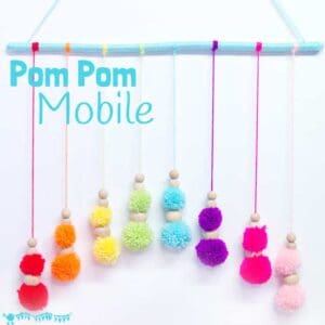 DIY RAINBOW POM POM MOBILE - brighten up your baby nursery, kids bedrooms or add a splash of colour to your living area with this cute and easy craft. A super way to use up yarn scraps.
