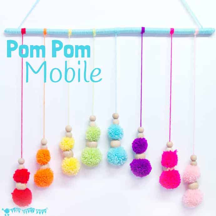 DIY RAINBOW POM POM MOBILE - brighten up your baby nursery, kids bedrooms or add a splash of colour to your living area with this cute and easy craft. A super way to use up yarn scraps.