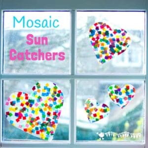 HEART SUNCATCHER MOSAICS for kids look gorgeous! Window art that's pretty, colourful and easily adaptable for kids of all ages. Fun for Valentine's Day, Mother's Day and Summer. #valentine #valentinesday #valentinesdaycraft #heartcrafts #mothersdaycrafts #kidscrafts #suncatcher #suncatchercrafts #kidsactivities #craftsforkids #summer #summercrafts #preschoolcrafts #craftideasforkids #valentinecraft #valentinescrafts #valentinecrafts #valentinesdayforkids #kidssummercrafts