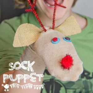 Put those old odd socks to good use and recycle them into adorable Christmas Reindeer No-Sew Sock Puppets. A great Christmas craft for kids. #reindeer #reindeercrafts #kidscrafts #christmascrafts #puppets #recycledcrafts