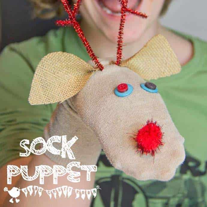 Put those old odd socks to good use and recycle them into adorable Christmas Reindeer No-Sew Sock Puppets. A great Christmas craft for kids. #reindeer #reindeercrafts #kidscrafts #christmascrafts #puppets #recycledcrafts