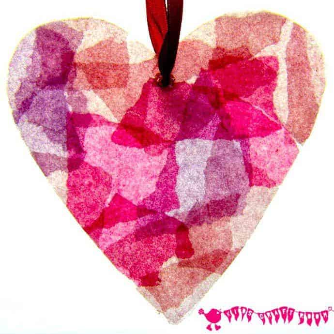 STAINED GLASS HEARTS Can you believe these pretty hearts are made from old milk jugs? A fabulous kids craft for Valentine's Day or Mother's Day.