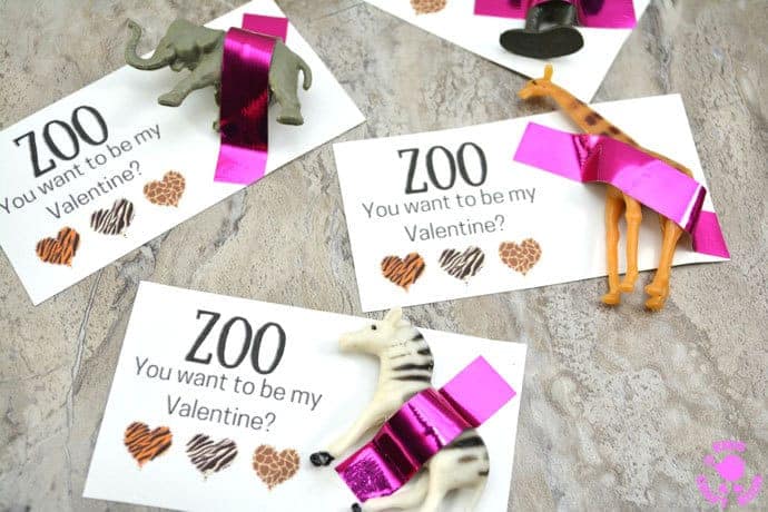 Zoo You Want to be My Valentine? Who could resist these Valentine favors? Printable Wild Animal Valentine Cards are so easy and sweet. Print the free cards and attach a mini animal for a Valentine gift everyone will love. A great Valentine idea for friends and loved ones big and small! #valentine #valentinesday #valentinesdaycrafts #valentinecraft #valentinescrafts #valentinecrafts #valentinesdayforkids #heartcrafts #valentinecards #freeprintables #printablecrafts #kidscrafts